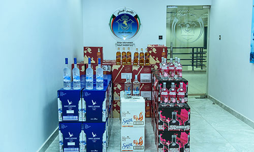 Asians arrested with 171 cartons of  alcohol