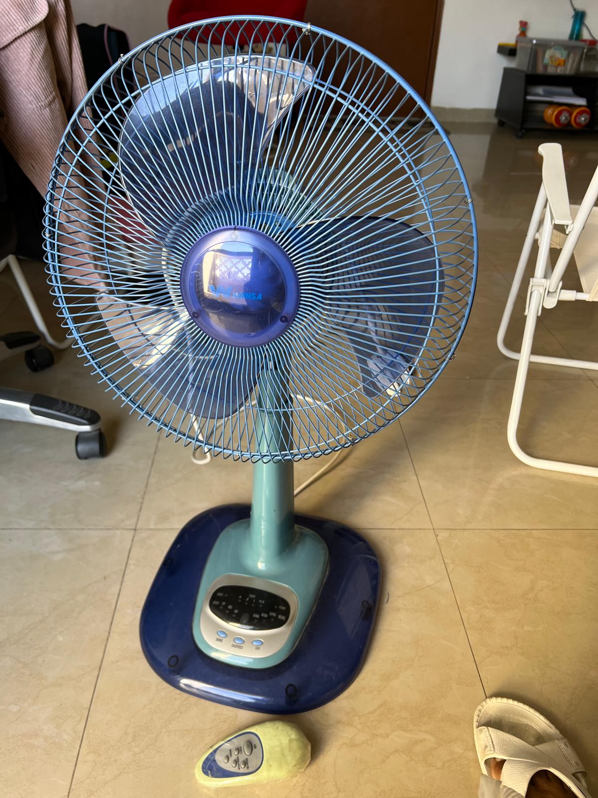 Pedestal Fan With Remote Control, Height adjustable and Revolving around.   