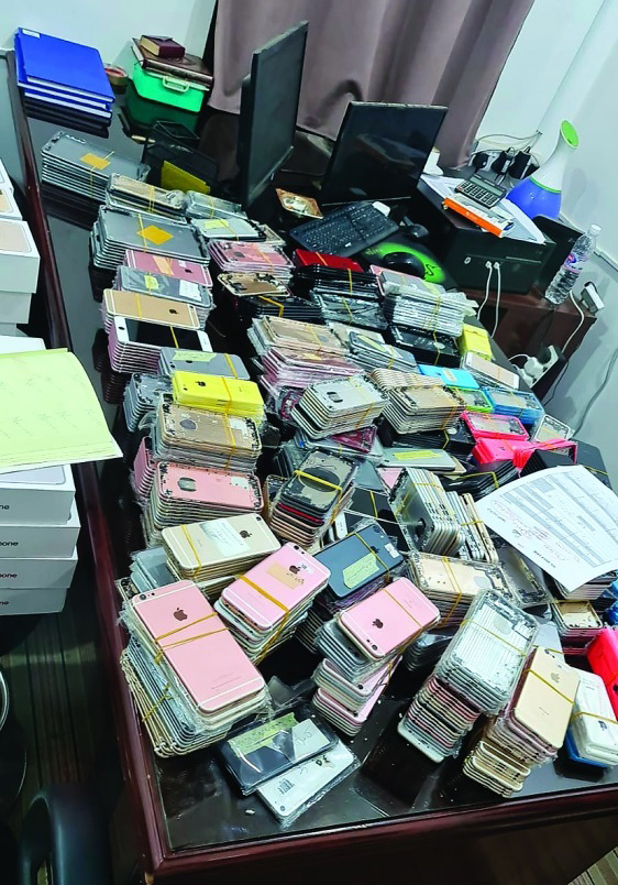 Authorities seized a shop that repairs used phones and sells them as new